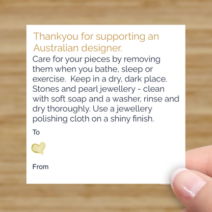 Small white promotional cards 6.9 cm x 6.9 cm with Australian Designer